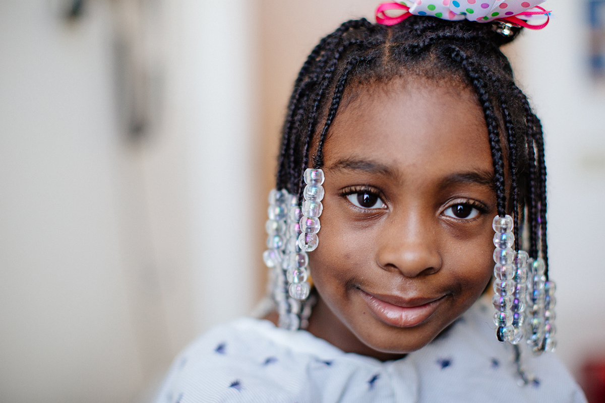 girl smiling in hospital gown