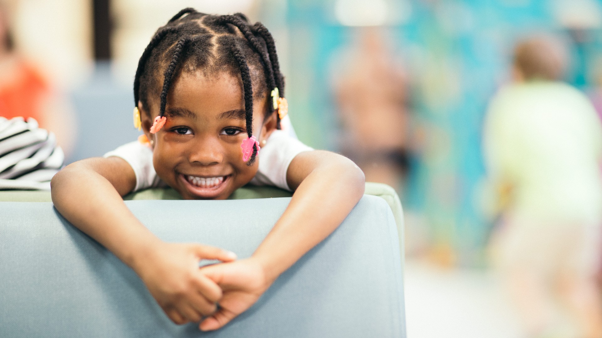 Young girl smiling in waiting room